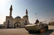 Baghdad Blasts and Attacks Kill Dozens