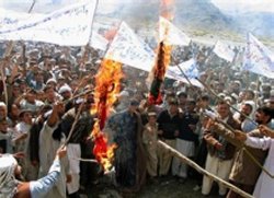 Afghans threaten attacks on troops over cartoon 