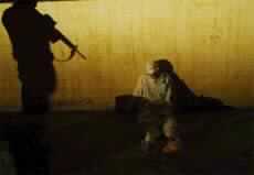 U.S. Takes Custody of 3 Iraq Officials and Raid Saddam